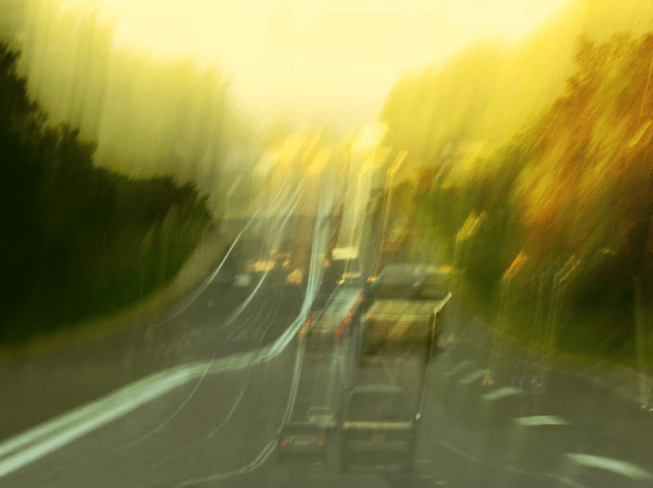 Blurred photo of cars driving on a road