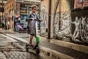 Girl riding on electric scooter